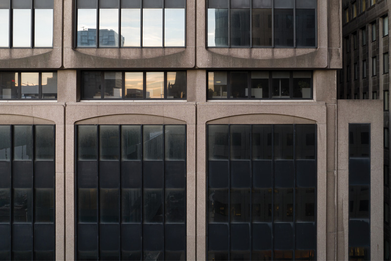 Close-up of the 1080 Beaver Hall façade, showing windows and concrete structure.